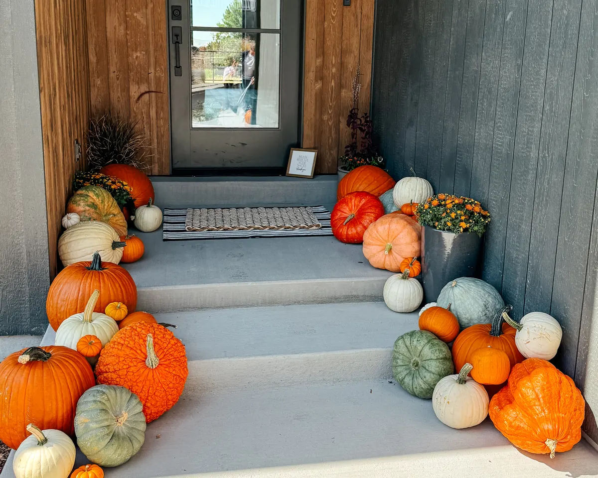 An elegant statement display of heirloom pumpkins commanding a front entry